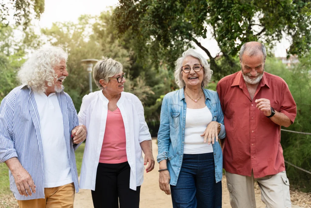 Group of senior friends walking outside together
